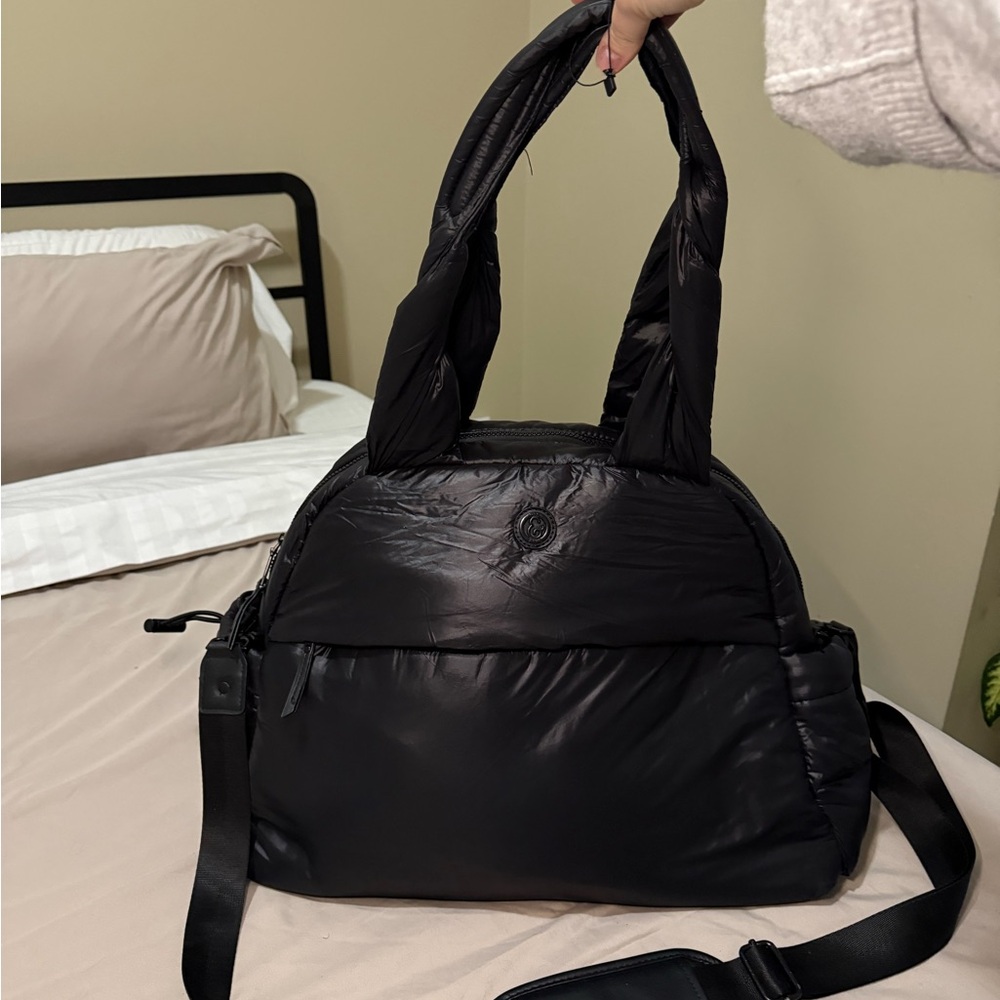 Black puffy carry-on bag